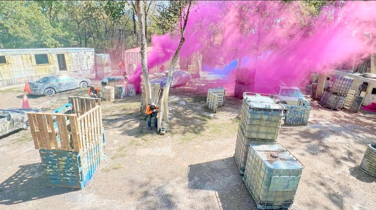 Corporate team building through outdoor paintball challenges
